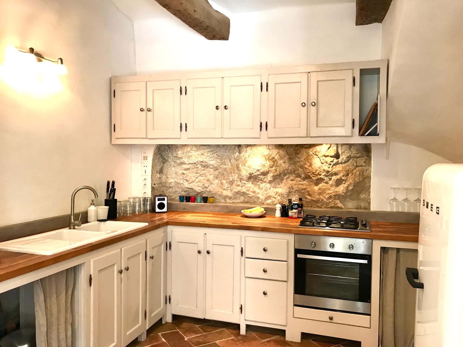 Dining room and the kitchen against the rock